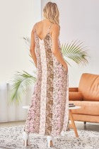 We love this unique print all over the maxi dress with v neckline. Non sheer, lined.
100% RAYON