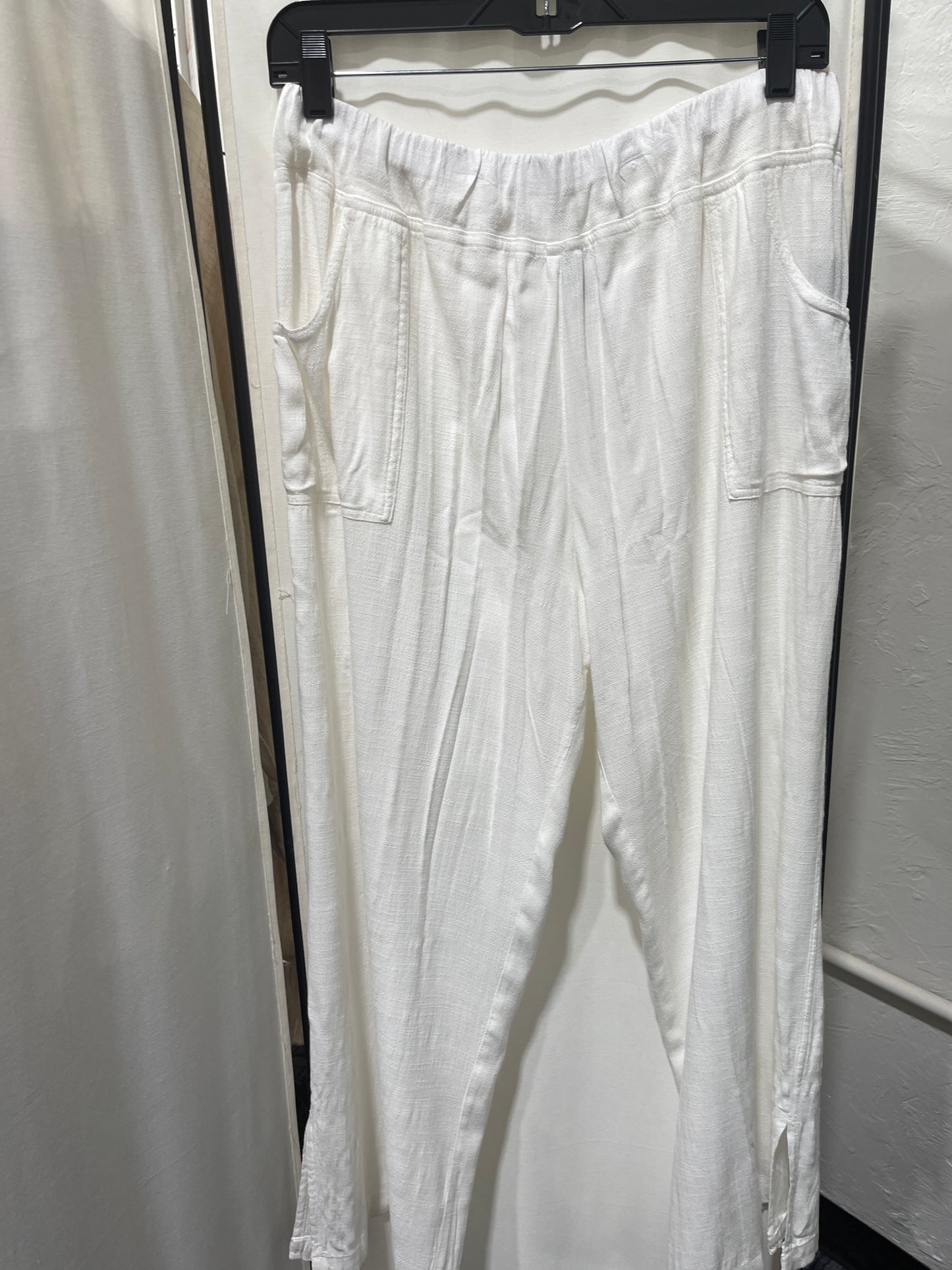 White modal, rayon, and spandex blend, wide leg pants, super comfortable, elastic waist band, front pockets, side slits bottom of legs. Oversized can size down