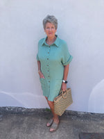 New style of summer dress with choice in two colors, light blue and green. Block type sleeves. And front pockets. 