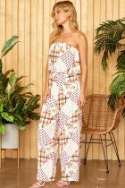 
This patchwork print jumpsuit features tube like bodice with boxy pants. Elastic on the waist. Lined, woven.
100% RAYON 