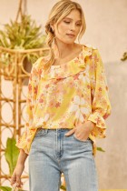 Cute daisy floral print all over this cute top with ruffle on the neckline featuring 3/4" sleeves. Relaxed fit. Easy body. Woven.